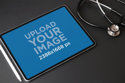 Mockup of an iPad Placed Nearby a Stethoscope
