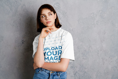 T-Shirt Mockup Featuring a Woman With a Thoughtful Expression