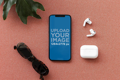 iPhone 12 Pro Max Mockup Featuring a Set of AirPods and a Pair of Sunglasses