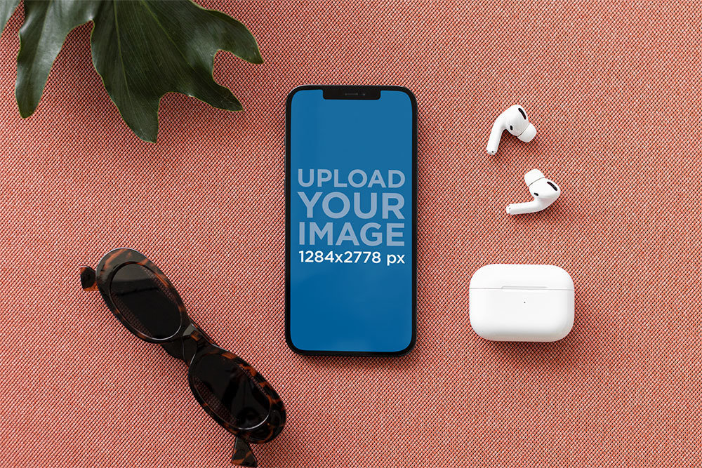 iPhone 12 Pro Max Mockup Featuring a Set of AirPods and a Pair of Sunglasses