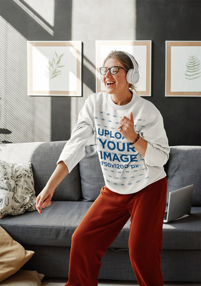 Sweatshirt Mockup of a Joyful Woman Dancing in Her Living Room