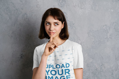 T-Shirt Mockup Featuring a Young Woman Asking for Silence 
