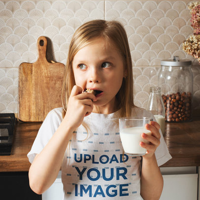 T-Shirt Mockup of a Girl Eating a Cookie in the Kitchen m19590-r-el2