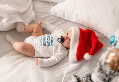 Mockup of a Baby Wearing a Long Sleeve Heathered Onesie and a Xmas Hat m20585-r-el2