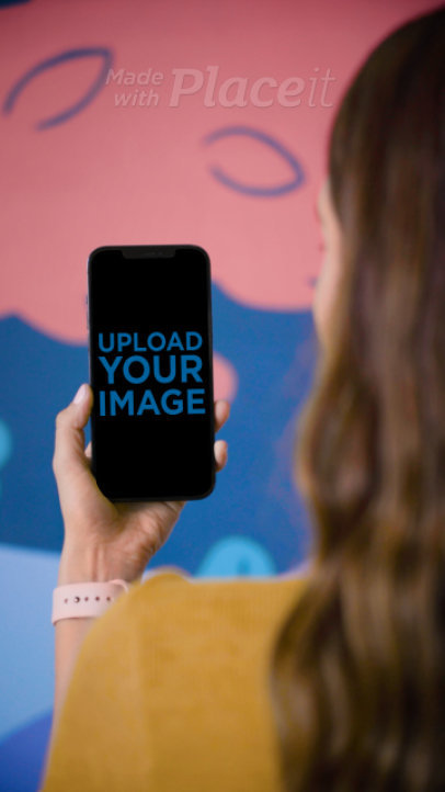 Video of a Woman Holding an iPhone 12 Pro Max 4751v