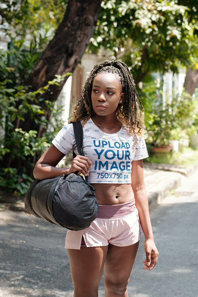 Crop Top Mockup of a Woman with Braids Carrying a Gym Bag m20720-r-el2