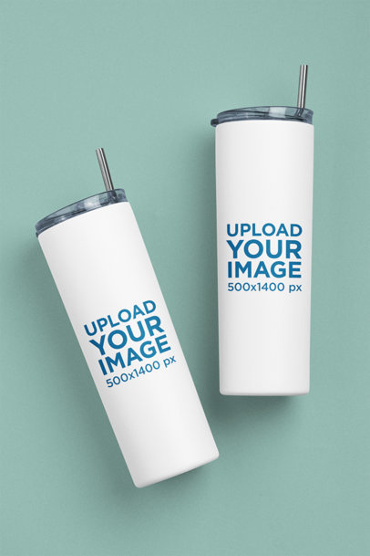 Simple Mockup Featuring Two Skinny Tumblers Lying on a Flat Surface