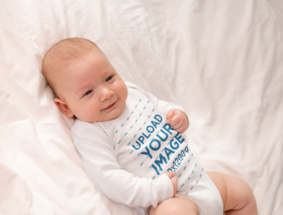 Onesie Mockup Featuring a Happy Baby Boy Lying Down