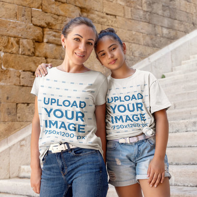 Heathered T-Shirt Mockup Featuring a Mom and a Daughter Smiling and Hugging