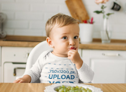 Long Sleeve Onesie Mockup of a Baby Boy Sitting at the Table m21197-r-el2
