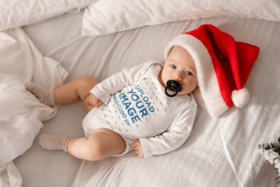 Long Sleeve Onesie Mockup of a Baby With a Xmas Hat 