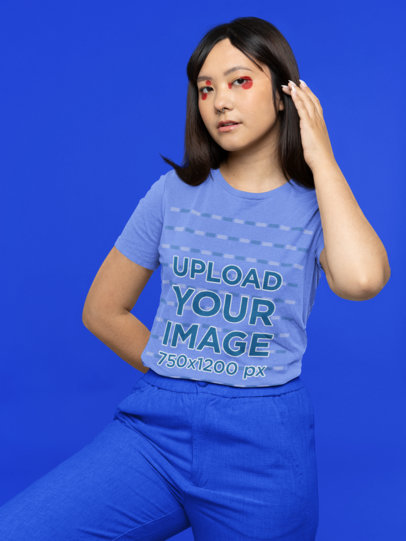Bella Canvas T-Shirt Mockup of a Young Woman Wearing Graphic Makeup at a Studio