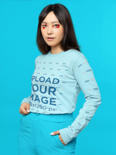 Long Sleeve Tee Mockup of a Woman With Graphic Makeup in a Studio