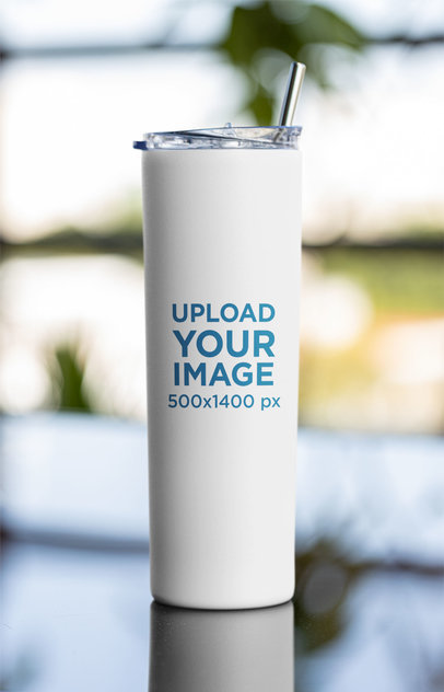 Mockup of a Skinny Tumbler Against a Blurry Background 
