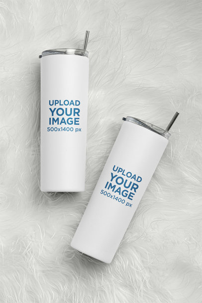 Mockup of Two Skinny Tumblers Placed on a Textured Surface