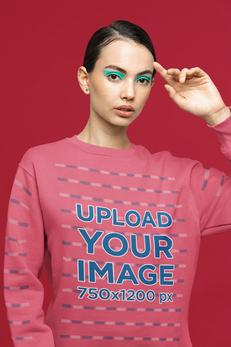 Sweatshirt Mockup Featuring a Woman with Euphoria-Inspired Makeup Posing at a Studio