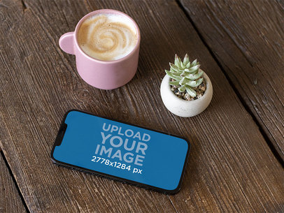 Digital Mockup Featuring an iPhone 12 Pro Max Over a Wooden Table m21931