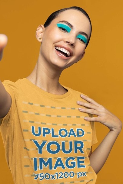 T-Shirt Mockup of a Woman With Euphoria-Inspired Makeup Taking a Selfie
