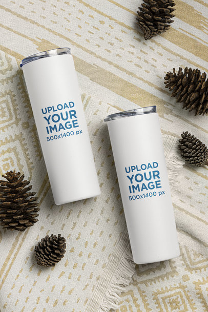 Mockup of Two Skinny Tumblers Surrounded by Pinecones m21461
