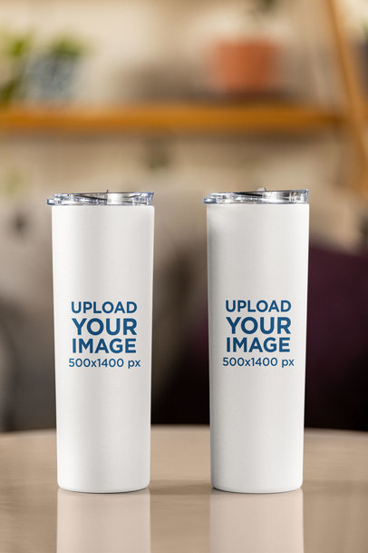 Mockup of Two Skinny Tumblers with a Blurry Background