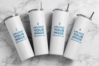Mockup of Four Skinny Tumblers on a Marble Surface