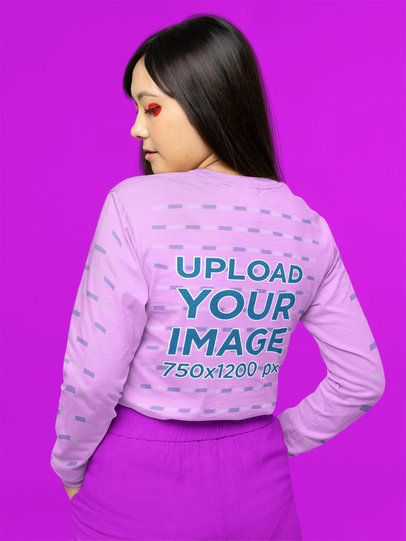 Back-View Mockup of a Woman in a Long Sleeve Tee With Customizable Sleeves