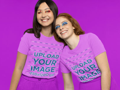 Bella Canvas T-Shirt Mockup Featuring Two Happy Friends Wearing Graphic Eye Makeup