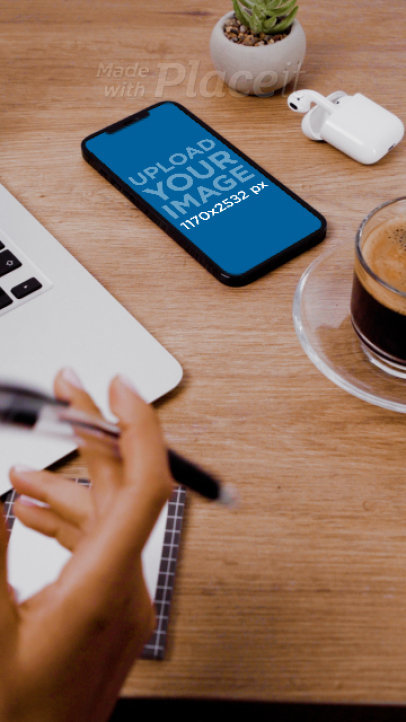 Video of an iPhone 12 Pro Max on a Woman's Desktop 4747v