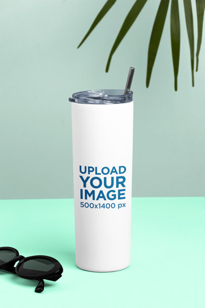 Mockup of a Skinny Tumbler Placed Next to a Pair of Sunglasses