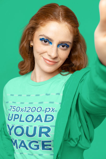 Long Sleeve Tee Mockup of a Woman With Euphoria-Inspired Makeup Taking a Selfie