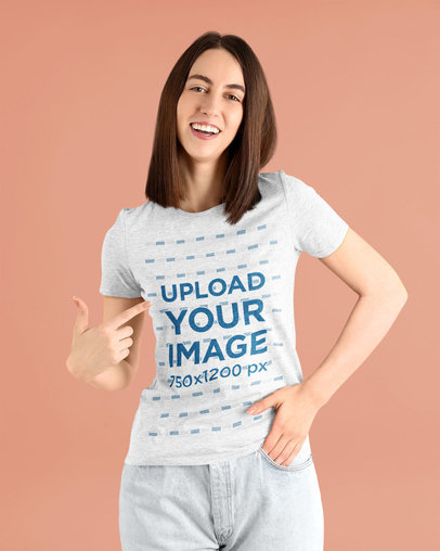 Mockup of a Woman Pointing at Her Heather T-Shirt at a Studio