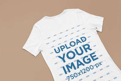 Flat Lay Bella Canvas T-Shirt Mockup Lying Over a Customizable Surface