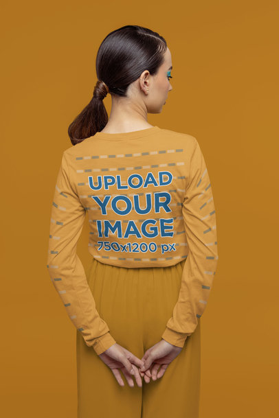 Back-View Mockup of a Woman Wearing a Long Sleeve Tee in a Monochrome Setting