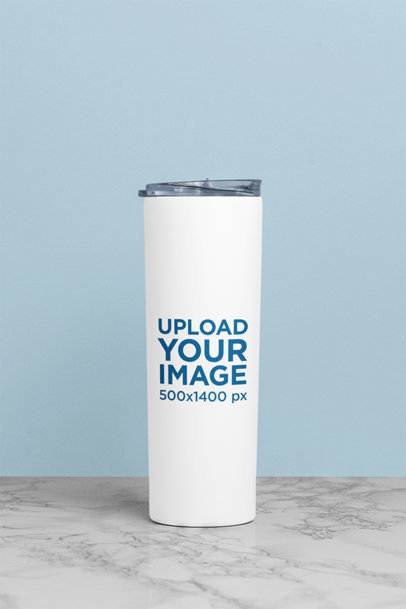 Mockup of a Skinny Tumbler on a Marble Table