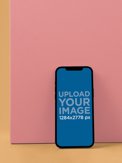 Digital Mockup of an iPhone 12 Pro Max Leaning over a Cube in Portrait Position