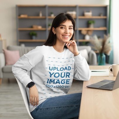 Crewneck Sweatshirt Mockup of a Cheerful Woman Working in Her House