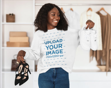 Crewneck Sweatshirt Mockup of a Cheerful Woman Holding a Pair of Heels and Sneakers m16446 r-el2
