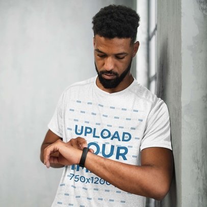 Heathered T-Shirt Mockup of a Man Looking at his Watch