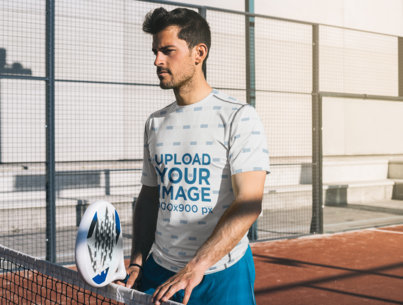 T-Shirt Mockup Featuring a Tennis Player Holding a Racket on the Court