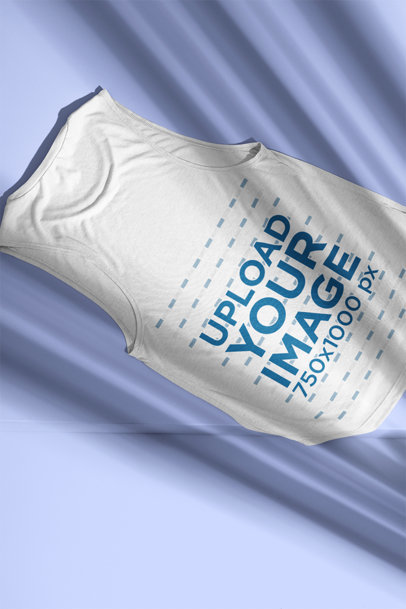 Mockup of the Back of a Bella Canvas Tank Top Lying on a Flat Surface