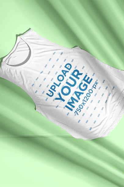 Mockup of a Bella Canvas Sleeveless Shirt Laid Flat on a Surface m13436