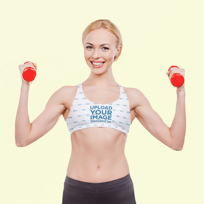 Sports Bra Mockup of a Fit Woman Holding Vinyl Dumbbells
