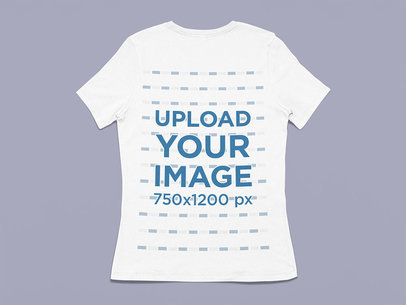 Mockup of a Women's Tee Lying Flat on a Customizable Colored Backdrop m13393