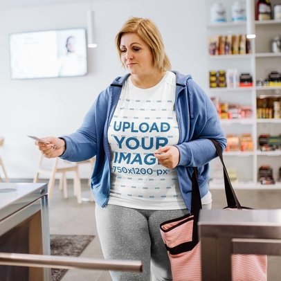 Plus-Size Tee Mockup of a Woman Opening an Automatic Gate Machine at the Gym m21410-r-el2