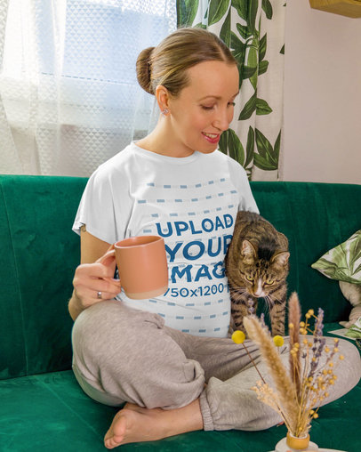 T-Shirt Mockup Featuring a Pregnant Woman Chilling With Her Cat