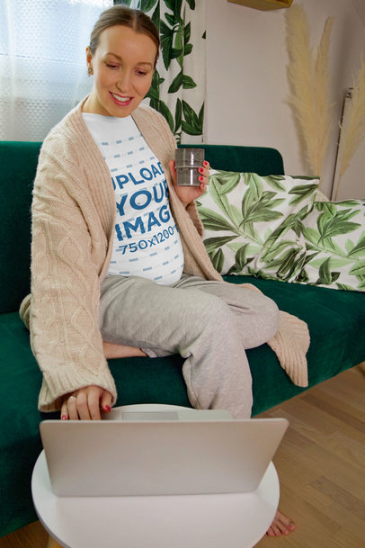 T-Shirt Mockup of a Pregnant Woman Using Her Computer at Home