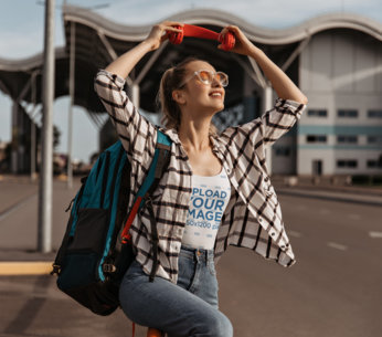 Tank Top Mockup of a Cheerful Woman Putting on Her Headphones While Walking on the Street m11941 r-el2