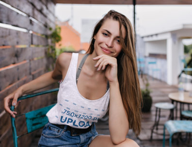 Heathered Tank Top of a Smiling Woman Looking at the Camera