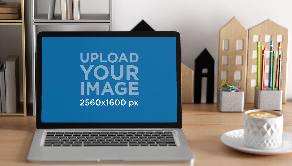 Digital Mockup of a MacBook Placed Nearby a Cup of Coffee