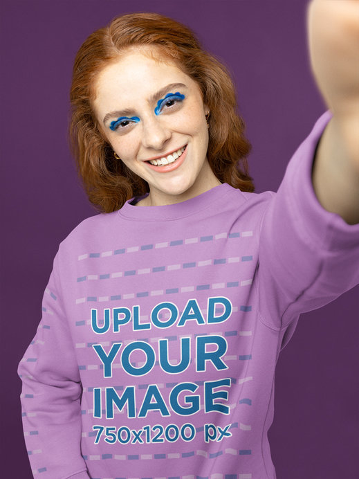 Sweatshirt Mockup of a Woman With Graphic Makeup Taking a Selfie